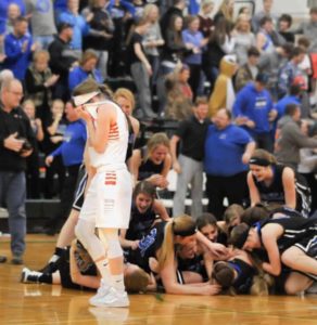 Winners' dogpile; loser's pain. Photo by Curt Hineline. Originally posted at https://www.facebook.com/sassefornebraska/photos/a.212619278903243.1073741828.207425149422656/748972235267942/?type=3&amp;theater